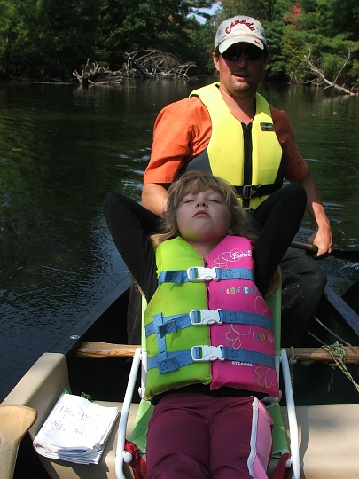 swift river sep 06 klea sleeping and chris paddling.jpg
